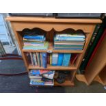 Pine bookcase with assorted books