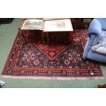 Large Persian Red ground Rug with central medallion