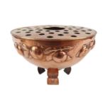 Newlyn Copper Flower bowl with raised pattern of fruit and vines against a beaten copper background,