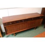 Mid Century Rosewood Veneered Sideboard of 4 drawers above double cupbaord base supported on
