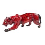 A Royal Doulton Flambé model stalking tiger, with Doulton mark to front foot. Length 35 cm.