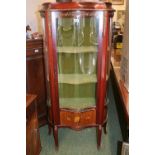 Early 20thC French serpentine fronted glazed cabinet with applied brass decoration & Lined interior.