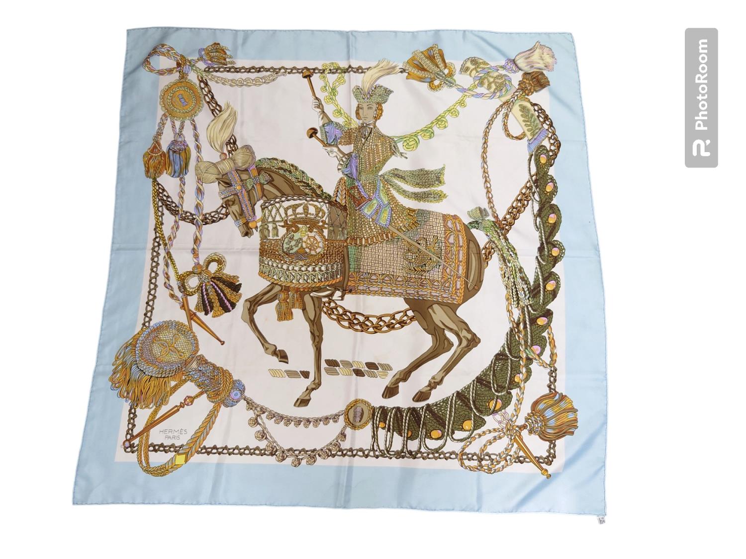 A Hermes silk 'Le Timbalier' print scarf, designed by Francoise Heron, incorporating a figure on