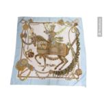 A Hermes silk 'Le Timbalier' print scarf, designed by Francoise Heron, incorporating a figure on