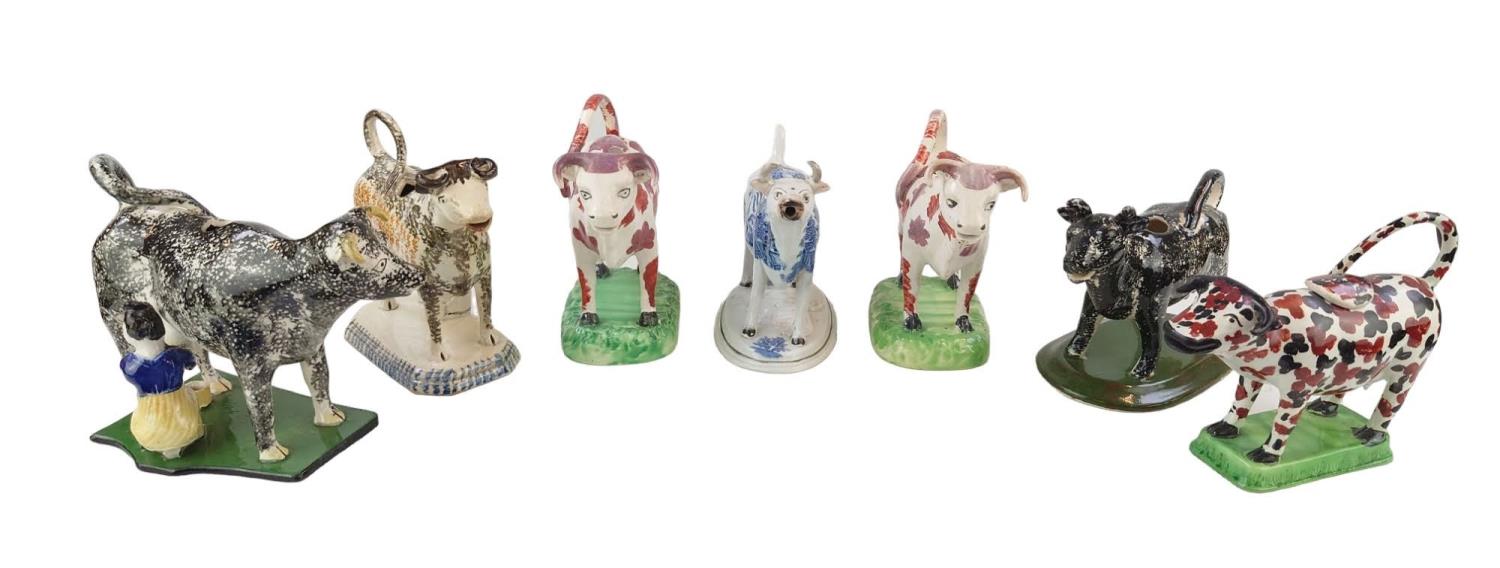 Collection of 18thC and later Staffordshire Cow Creamers to include Pearlware, Spongeware etc (7)