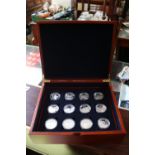 Cased set of 12 Silver 25 Dollar coins Elizabeth II Solomon 2003