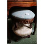 Pair of Oval Upholstered stools with carved bases