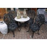 Wrought Iron marble topped table and four chairs
