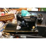 Cased Singer Portable sewing machine 221