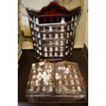 Collection of assorted Ceramic collectors thimbles in wooden racks