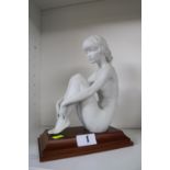 Kaiser Blanc de chine nude figure mounted on wooden plinth with blue underglaze mark impressed