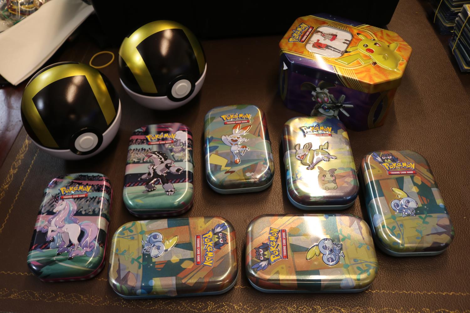 Ten various Pokémon playing card collectors tins to include two poke ball style