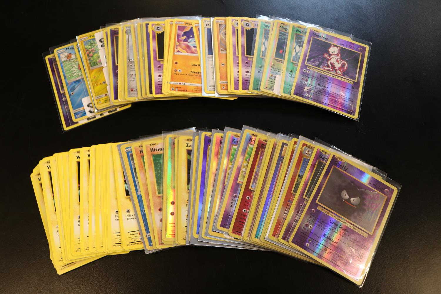 Quantity of Pokémon playing cards to include Mewtwo, Pikachu, Arcanine, Gastly etc