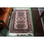 Beige ground 20thC Rug with tassel ends 130cm in Length
