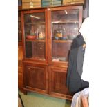 Large Glazed Cabinet with 2 door panelled base on bracket feet