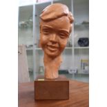Paul Serste Belgian 1910 - 2000, Terracotta bust of a young boy 36cm in Height signed to base