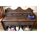 19thC Carved Oak dresser with Brass drop handles and carved front