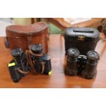 Pair of T B Winter & Sons Marine Binoculars and another pair of binoculars both cased