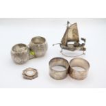 Pair of Silver Napkin rings, Hong Kong Silver boat, Silver Brooch 100g total weight and a Pair of