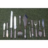 Box of assorted Silver handled Flatware inc Bread Knife, Forks etc