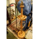 Turned Wooden revolving stick stand with surmounted Rabbit decoration and a Standard Lamp