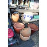 Large collection of Terracotta platers and a Chinese style glazed planter