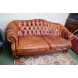 Large Brown Chesterfield style button back 3 seater Sofa on turned wooden caster feet