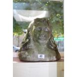 Patinated Carved Bust of a young woman in concrete. 29cm in Height