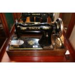 Oak Cased Singer Sewing machine complete with Key