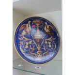 Continental Faience plate decorated with Storks and Urn on blue ground