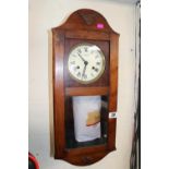 Oak cased wall clock by G Van Socien Batavia with roman numeral dial