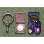 Heavy coppered Door Knocker, Deco travelling clock, Cased Ophthalmoscope & Cased Eye glass