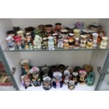 2 Shelves of assorted Toby Jugs inc. Quaker Oats, Allerton etc