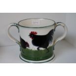 A Bristol Wemyss tyg, decorated with a black cockerel and hens, hand painted marks to base 10.5cm in