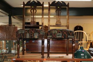 Pair of Edwardian Upholstered dining chairs with carved backs