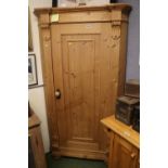 Tall Stripped Pine Scorner Cabinet with fitted shelves and panelled door with applied supports