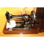 Mahogany cased Singer Sewing machine R303377