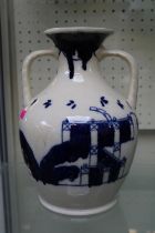 Early 20th century large delft style blue & white Portland vase with oriental influenced