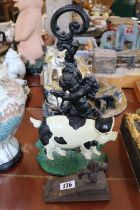 Cast Iron Cherub design doorstop, Painted Pig Doorstop and a Fleur de Lye doorstop