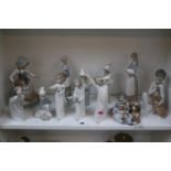 Collection of 12 Lladro ceramic figures to include Girls with Goose, Boy with Puppies etc 50