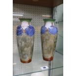 Pair of Royal Doulton glazed vases of cylindrical tapering form with flared rims decorated in Art