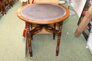 Oak Circular table on turned supports with cruciform gallery