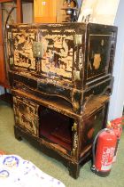 Pair of Chinese Lacquered 2 door cabinets with drawers to base on bracket feet, decorated with