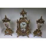 Franz Hermle European Clock and Garnitures with figural decoration and brass foliate decoration,