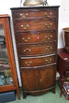 20thC Wellington style chest of 5 drawers with cupboard base and brass drop handles