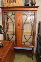 Edwardian Mahogany and walnut inlaid China cabinet of 2 doors with Inlaid detail over tapering