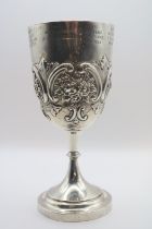 Sheffield Silver embossed presentation cup over turned stem and stepped base. 170g total weight