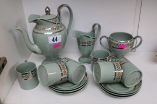 1930s wedgwood tea set with simple floral motifs and silver gilding.