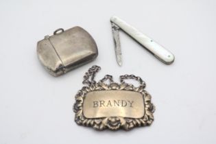 Silver Brandy Label, Silver Match Vesta and a Mother of Pearl Handled Fruit Knife