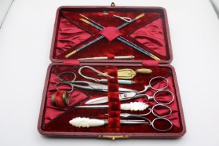 Good quality Cased travelling sewing set in Red Leatherette case
